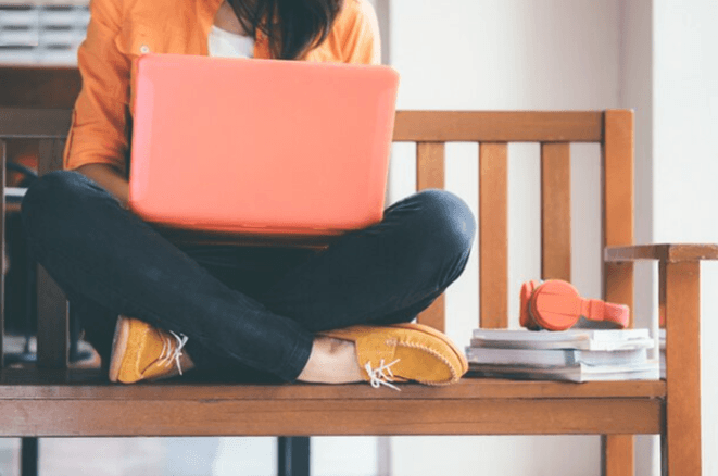 A girl leaning on laptop.